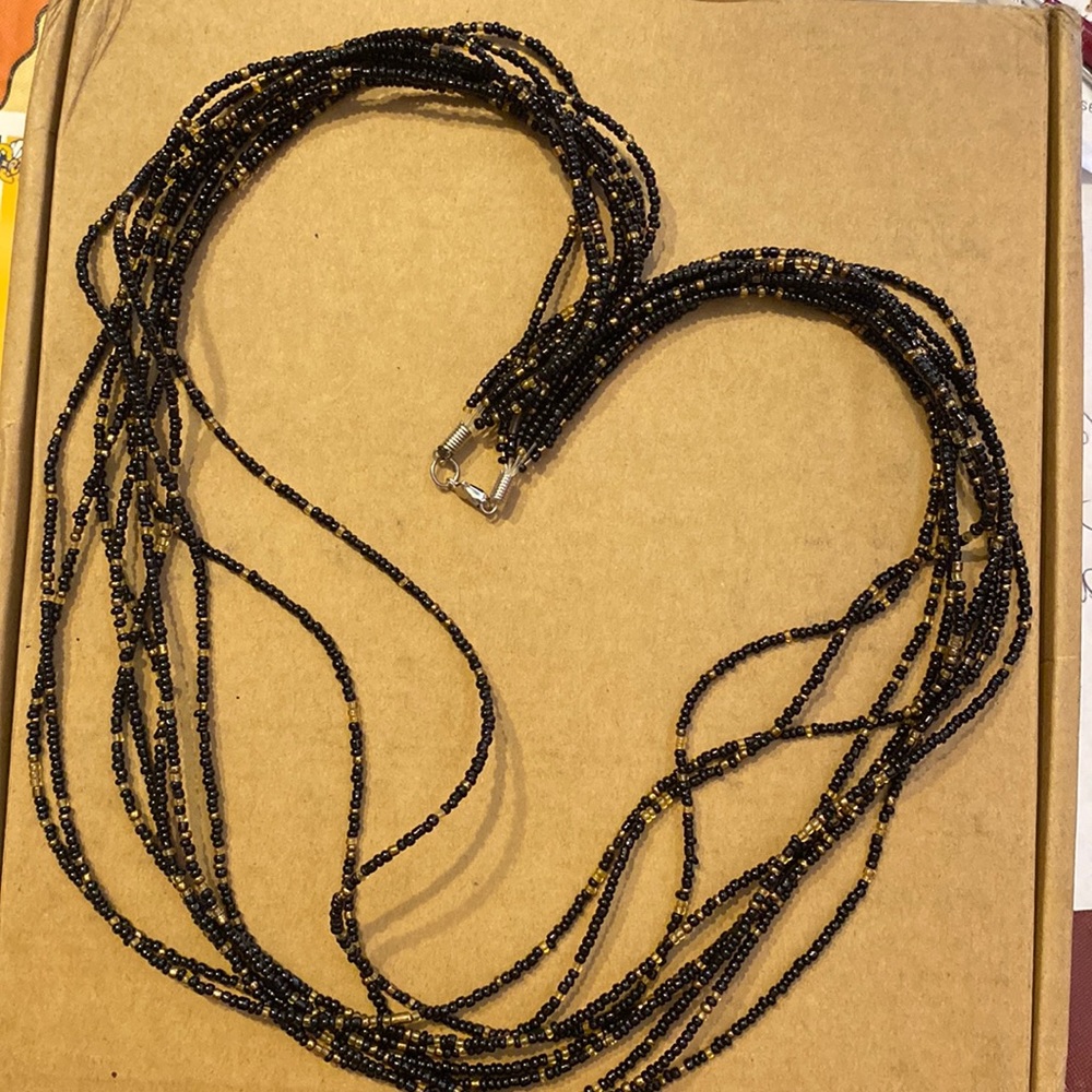Multi strand seed bead necklace 9 strands aprox 28”